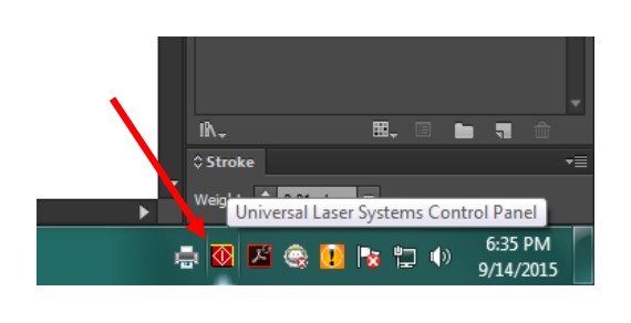 Windows taskbar with the Universal Laser Systems Control Panel icon in the lower right corner