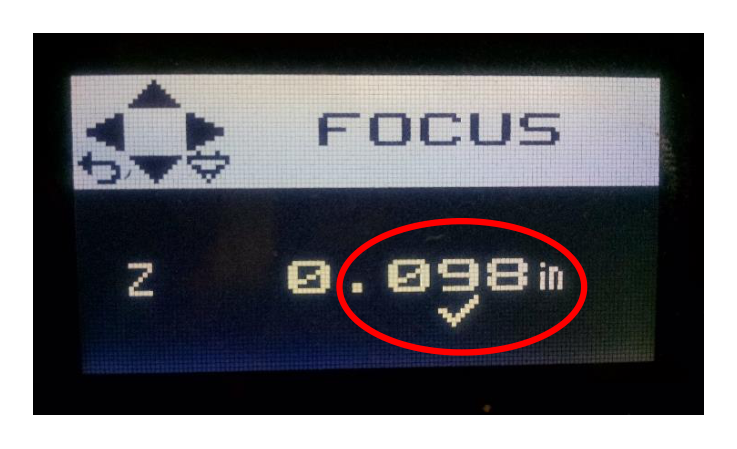 Laser cutter display showing FOCUS mode with the Z height value circled
